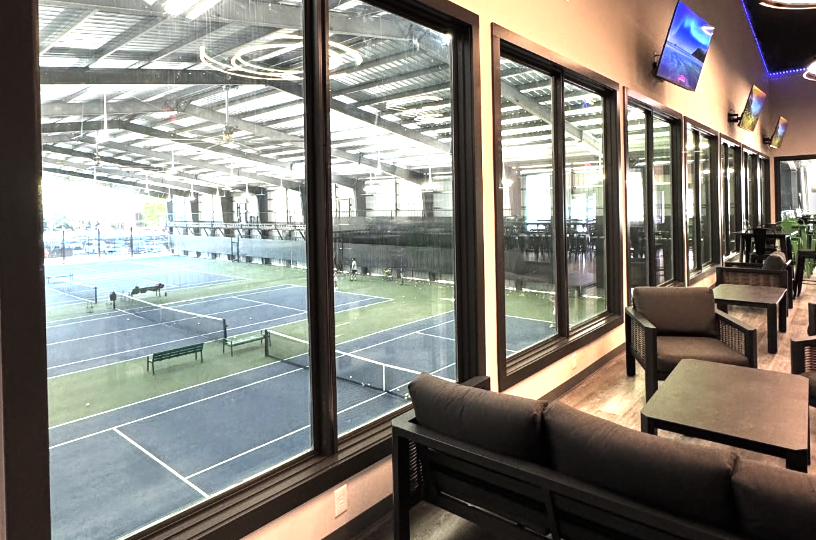 ITP Training Academy Lounge overlooking tennis courts